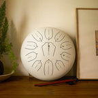 SonodrumSteelTongueDrumStandard-12Inches_11Tongues_CMajor-Sticks-White